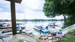 A dock area with boats, a wooden deck, and a view of a lake. - Lakehouse - Sleeps up to 20 w/ free boat slip.
WINTER REMODEL - PICS COMING SOON (Noblesville)