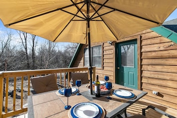 The balcony, located just off the kitchen on the upper level, offers a seamless transition to outdoor dining and relaxation. Stairs lead down to the spacious yard, providing plenty of room to enjoy the outdoors.