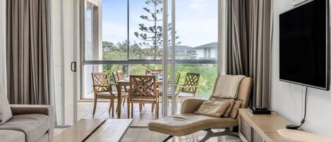 Deluxe Apartment, 3 Bedrooms, Garden View | Living area | Flat-screen TV