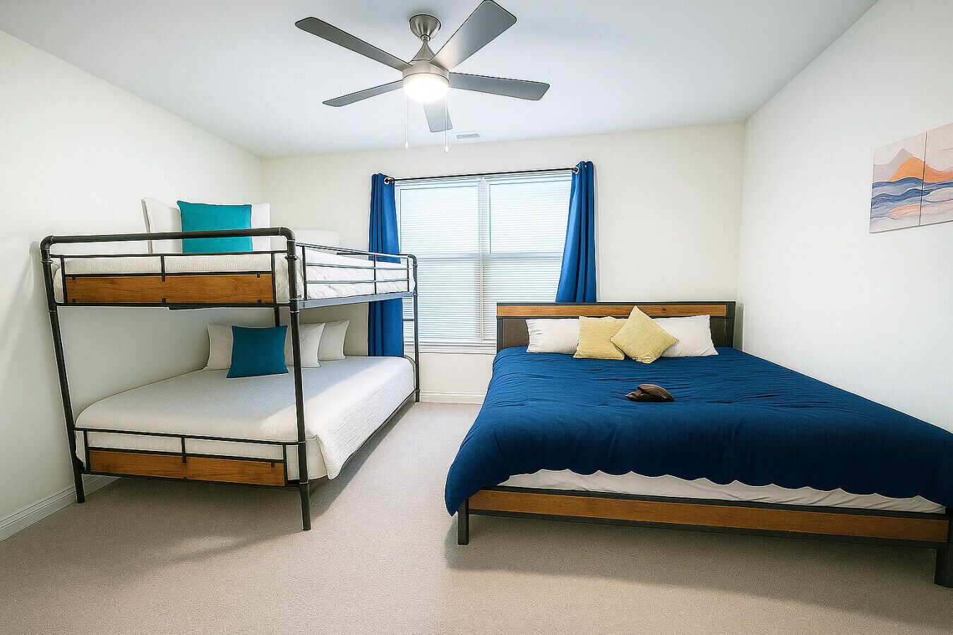 Un dormitorio con camas literas y una cama individual, un ventilador de techo, una ventana con cortinas y un cuadro en la pared.