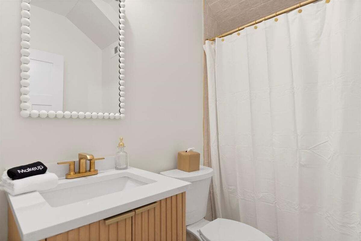 The Leopard Suite's ensuite bath features a spacious walk-in shower perfect for a refreshing rinse or a steamy escape.