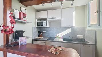 Fridge, coffee/tea maker, toaster, cookware/dishes/utensils