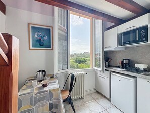 Fridge, coffee/tea maker, toaster, cookware/dishes/utensils