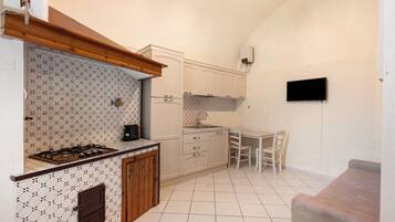 Fridge, stovetop, coffee/tea maker, cookware/dishes/utensils