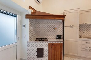 Fridge, stovetop, coffee/tea maker, cookware/dishes/utensils