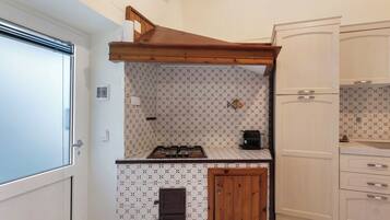 Fridge, stovetop, coffee/tea maker, cookware/dishes/utensils