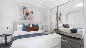 2 bedrooms, desk, iron/ironing board, travel crib