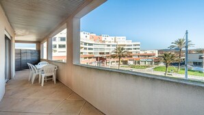 A balcony with a view of a residential area, including a hotel and a sports arena. - Bright apt with large balcony for 4 pers (Agde)