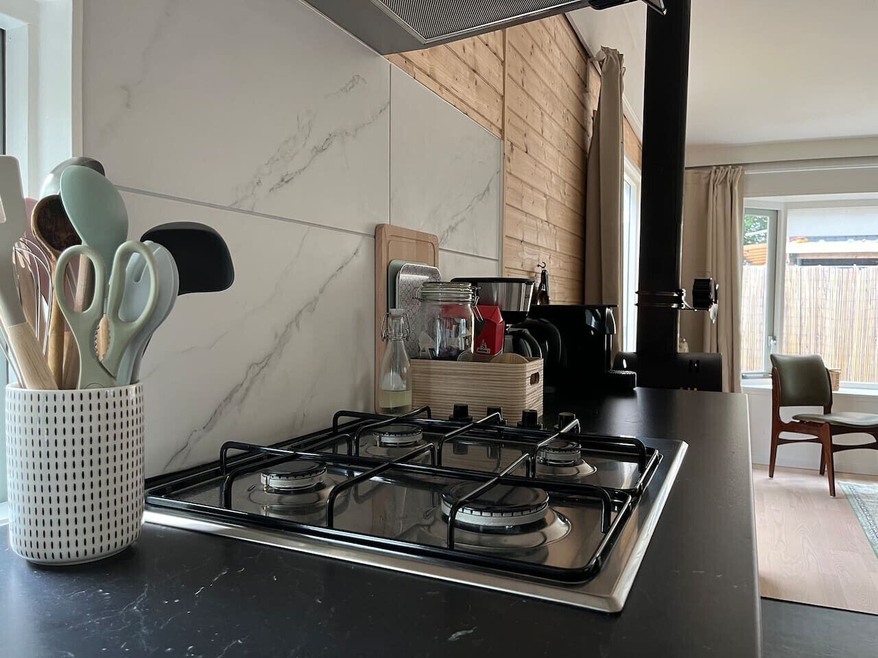 Fridge, dishwasher, coffee/tea maker, cookware/dishes/utensils