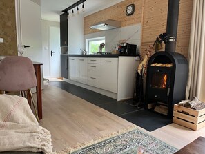 Fridge, dishwasher, coffee/tea maker, cookware/dishes/utensils