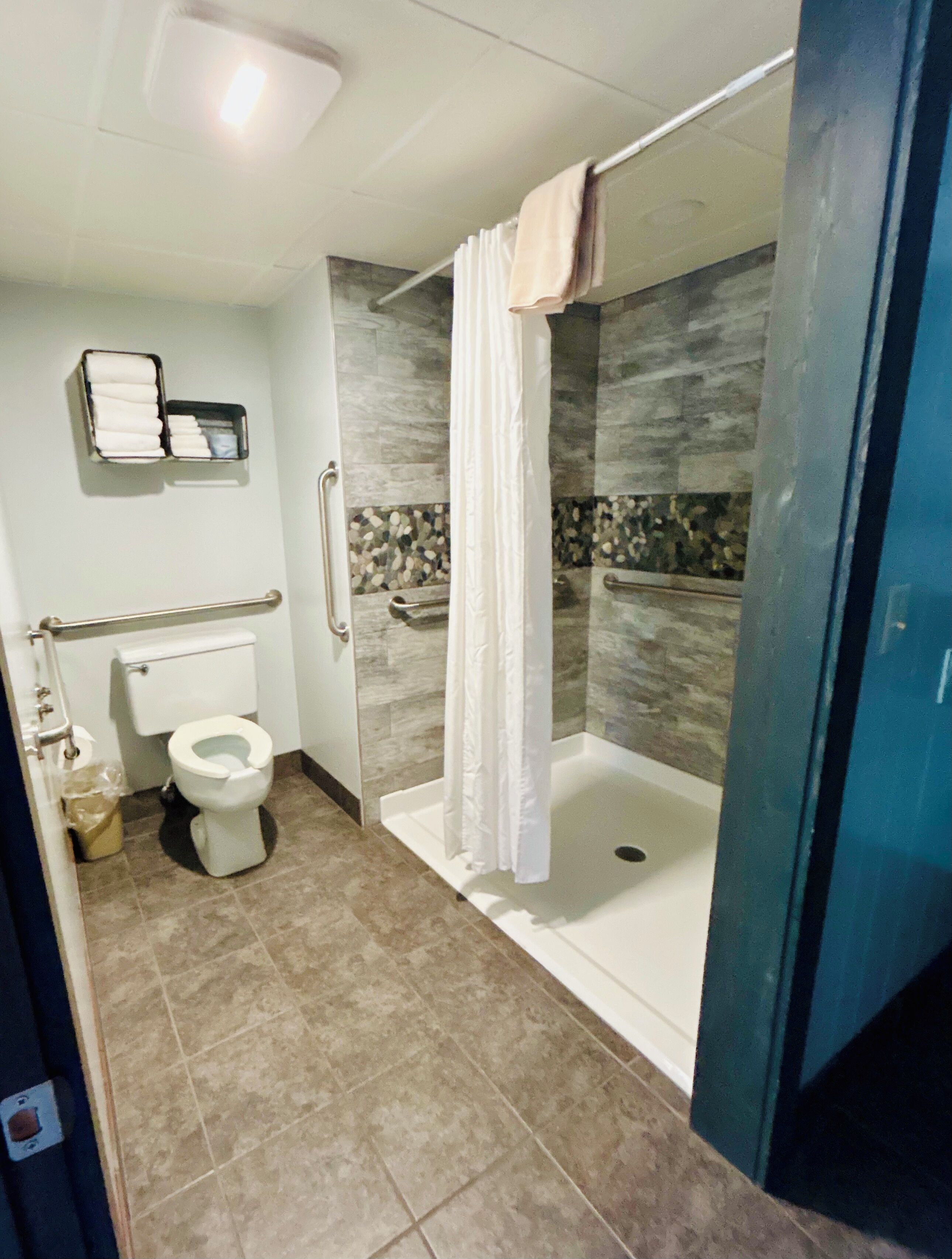 Double Room, Mobility Accessible | Bathroom | Combined shower/tub, hair dryer (on request), towels, soap