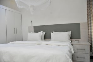 Deluxe Double Room, Garden View | Desk, laptop workspace, free WiFi