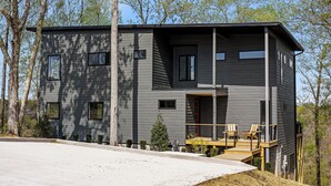 A modern two-story house with a balcony, a small deck, and a garage. - The Panorama Overlooking Center Hill Lake (Sparta)