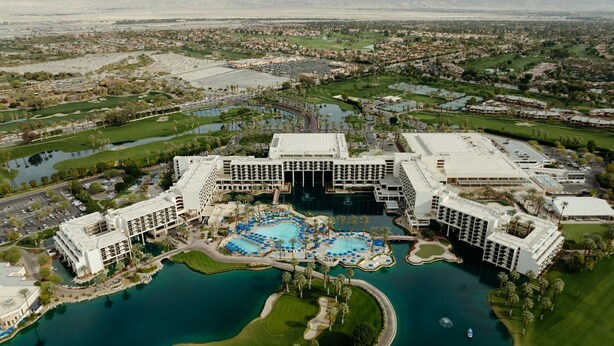 A large resort with multiple swimming pools, a golf course, and a central building with a flat roof. - Marriott Desert Spring Villas- available march 2-9 only (palm desert)