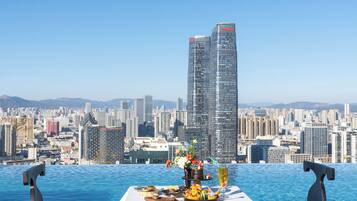 Outdoor pool, open 10:00 AM to 9:30 PM, pool umbrellas