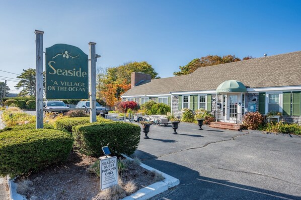 A seaside village with a sign reading "Seaside A Village on the Ocean".