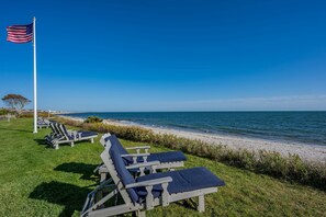 Relax on the beach with a clear view of the ocean from our lounge chairs.