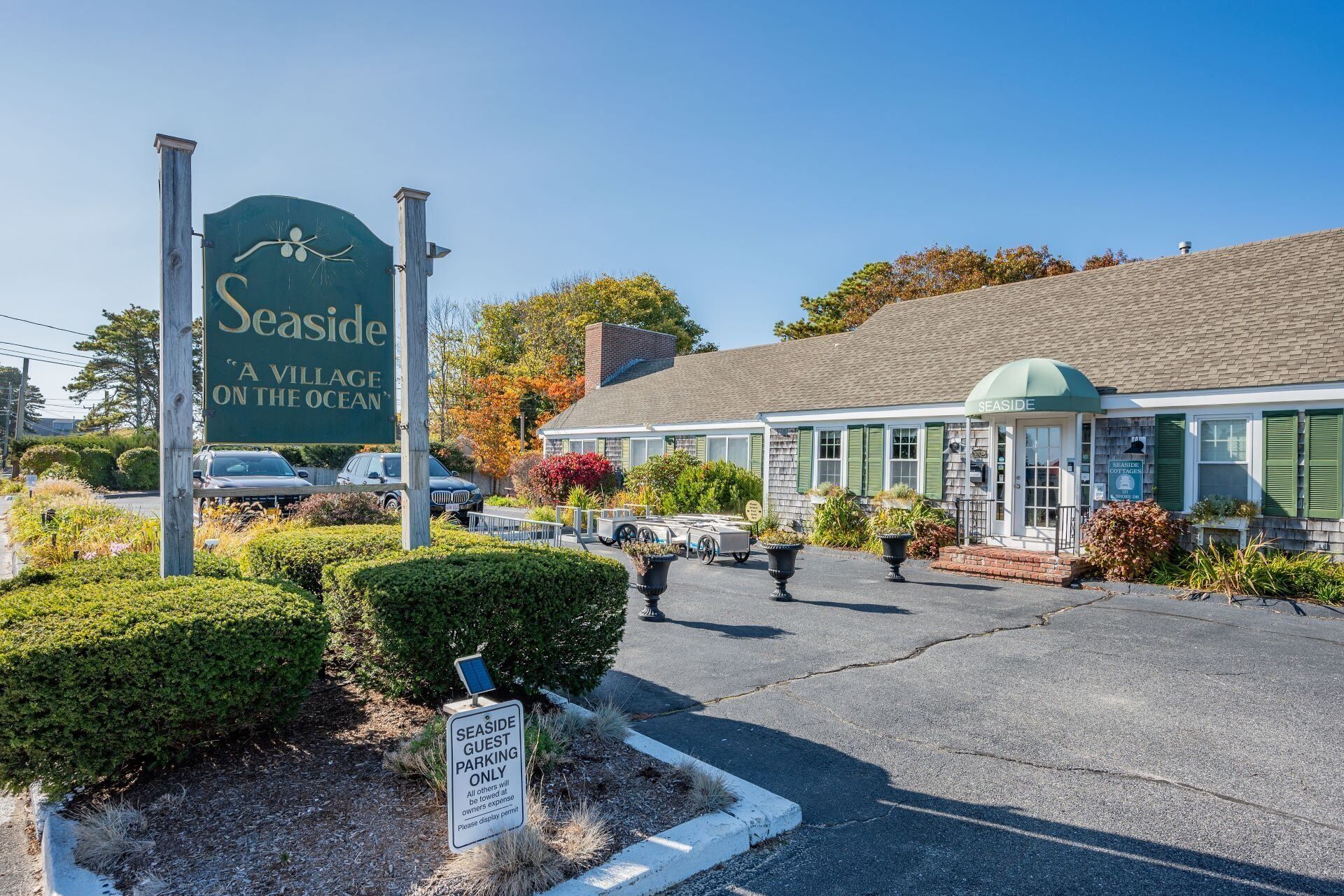 A seaside village with a sign reading "Seaside A Village on the Ocean".