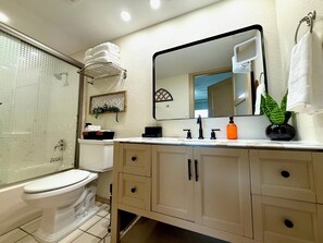 Shower, hair dryer, towels, soap