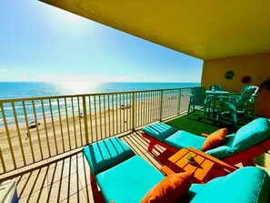 A balcony with a view of the beach, outdoor furniture, and a railing. - Southwest Surf...NEW NEW NEW, Oceanfront, Family Friendly, Pets (South Padre Island)