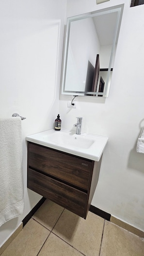 Shower, towels, soap, toilet paper