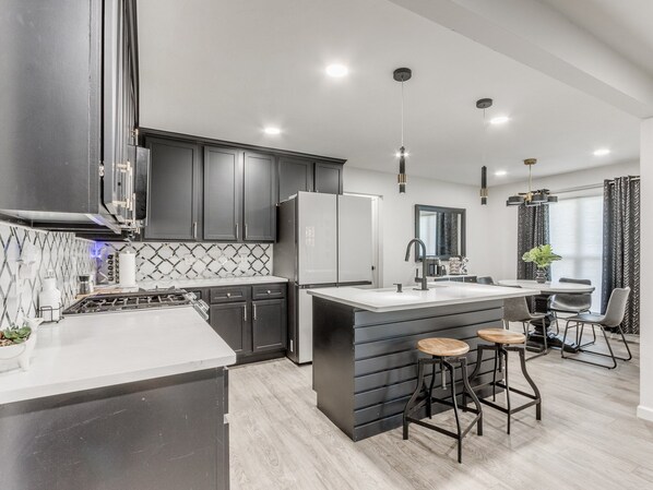 Fridge, microwave, stovetop, coffee/tea maker