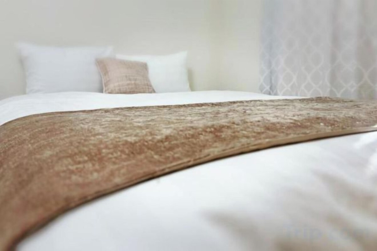 Premium bedding, down comforters, laptop workspace, blackout drapes