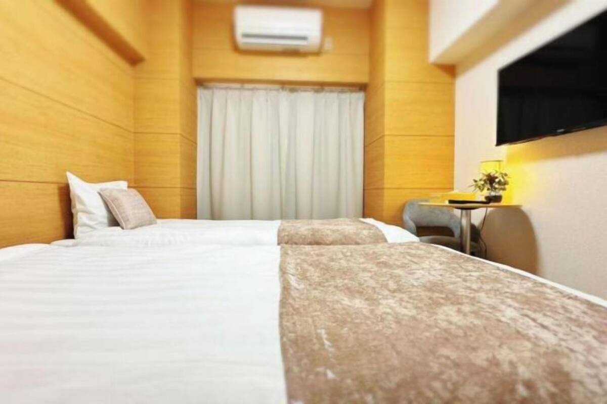 Premium bedding, down duvets, laptop workspace, blackout curtains