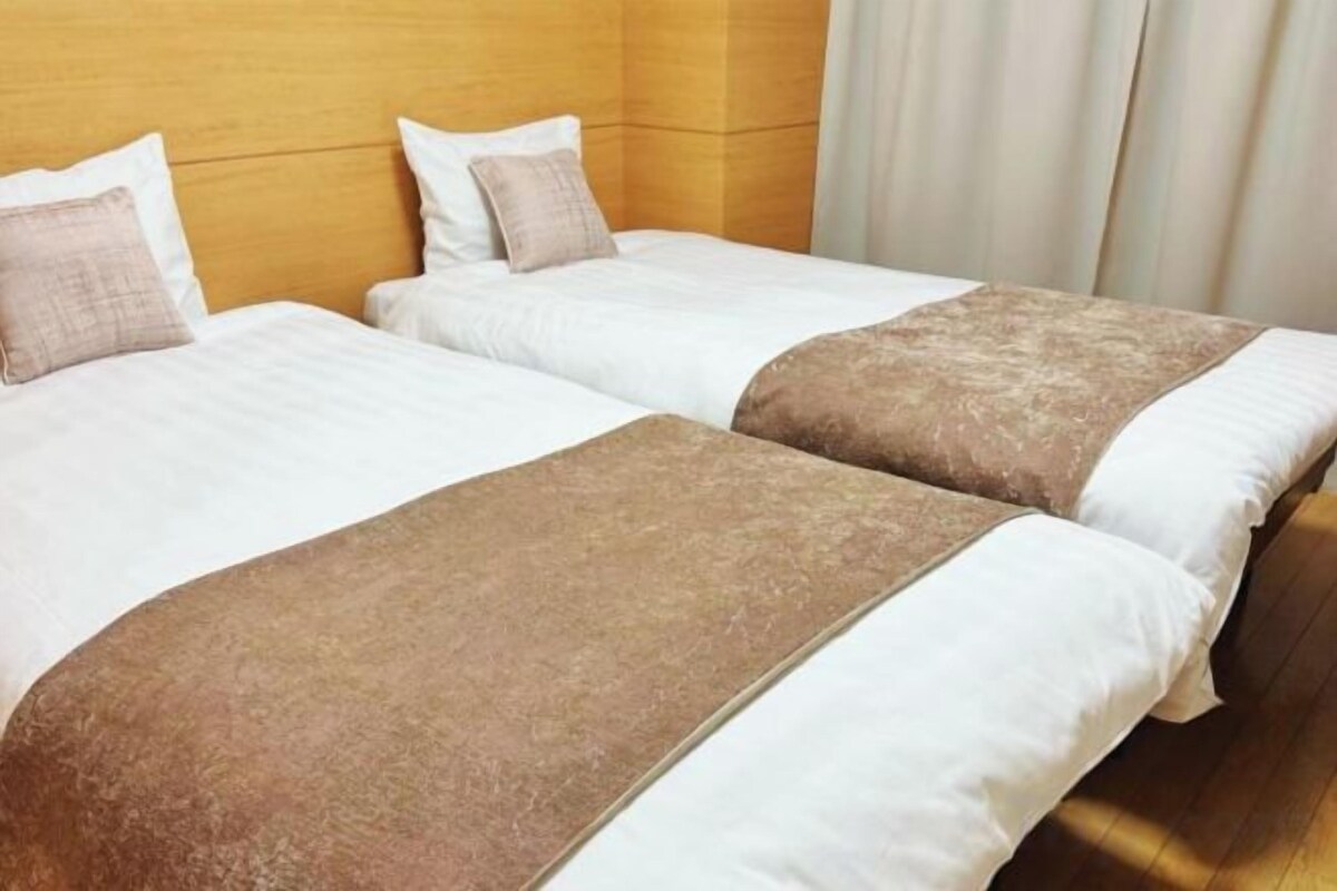Premium bedding, down comforters, laptop workspace, blackout drapes