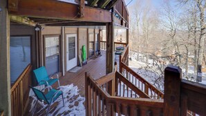 A wooden deck with a staircase leading to a second floor, surrounded by snow-covered ground. - < 1 Mi to Beech Mtn! All-Season Outdoor Retreat (Beech Mountain)