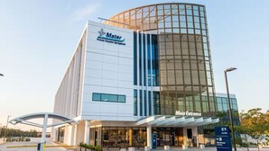 A modern hospital building with a prominent entrance labeled "Main Entrance."