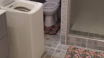 Shower, towels, soap, toilet paper