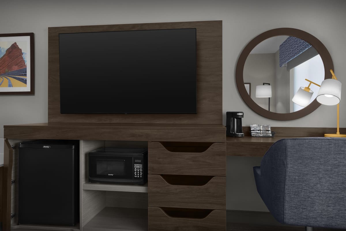 Desk, laptop workspace, blackout drapes, iron/ironing board