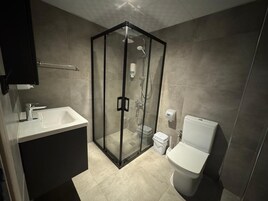 Triple Room, Balcony, City View | Bathroom | Shower, hair dryer, towels, soap