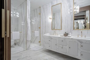 Executive Suite | Bathroom | Hair dryer, slippers, soap, shampoo