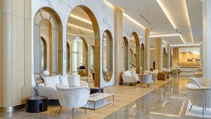 A spacious lobby with modern seating, large mirrors, and a polished marble floor. - Shusha Hotel & Conference Center (Shusha)