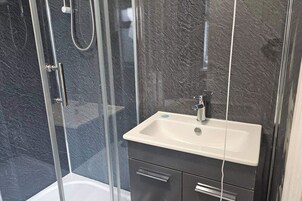 Shower, towels, toilet paper