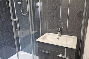 Shower, towels, toilet paper