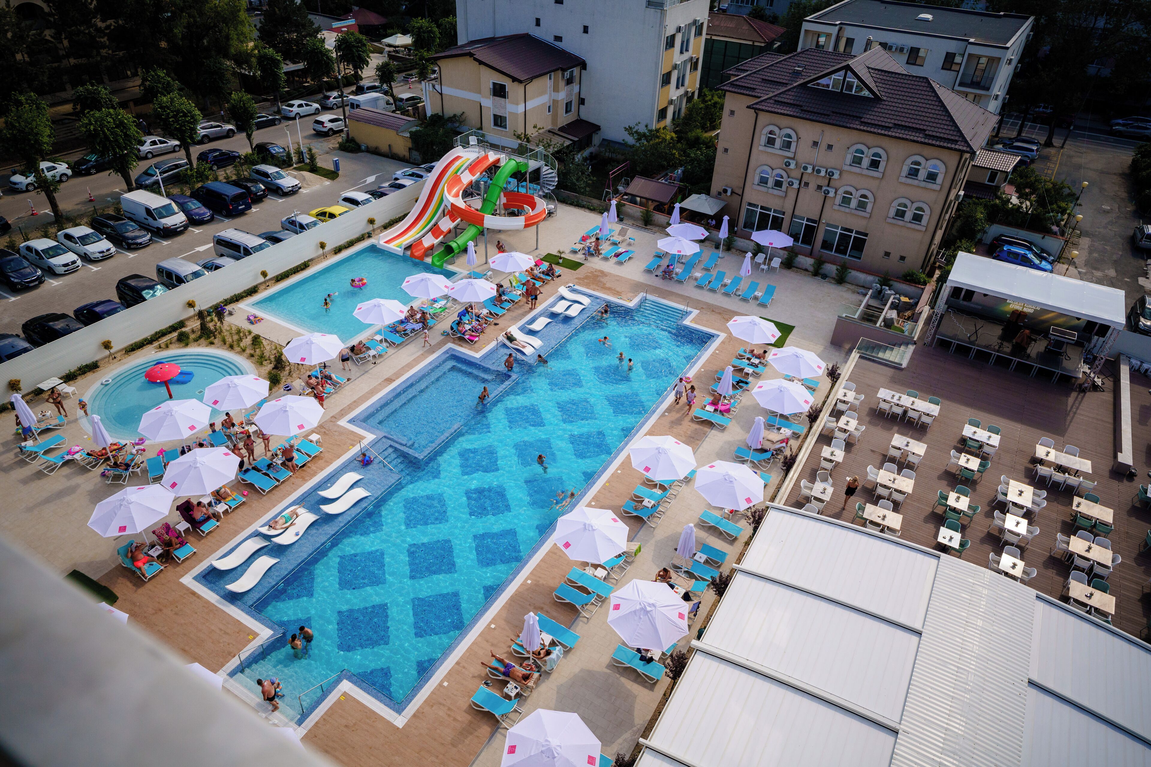 Seasonal outdoor pool, open 10:00 AM to 10:00 PM, pool umbrellas