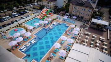 Seasonal outdoor pool, open 10:00 AM to 10:00 PM, pool umbrellas