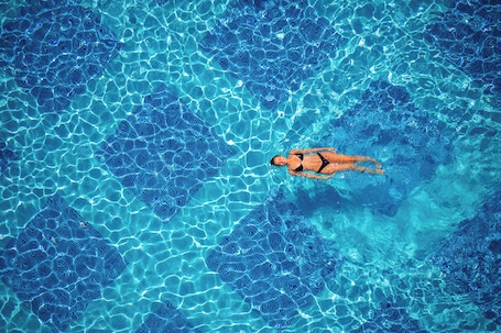 Seasonal outdoor pool, open 10:00 AM to 10:00 PM, pool umbrellas. Bacolux Koralio