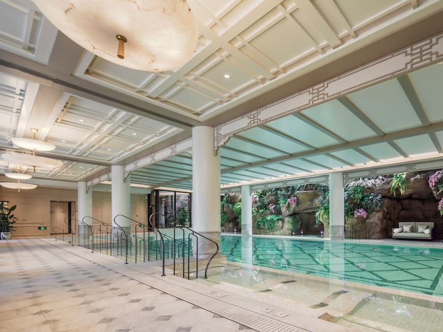 Indoor pool, open 6:00 AM to 10:00 PM, pool loungers, lifeguards on site