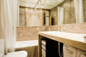 Bathtub, hair dryer, towels