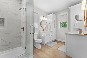 Shower, hair dryer, towels, shampoo