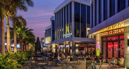 Smart Compact Studio with Convertible Queen Bed , Sofa and Kitchenette and shared community garden