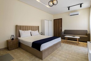 1 bedroom, iron/ironing board, WiFi, bed sheets - Comfy Studio with Balcony | Queen Bed , Sofa and Kitchenette and shared community garden (Golden Gates , Mokkatm)