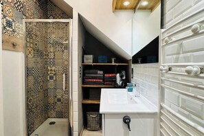 Shower, hair dryer, towels, soap