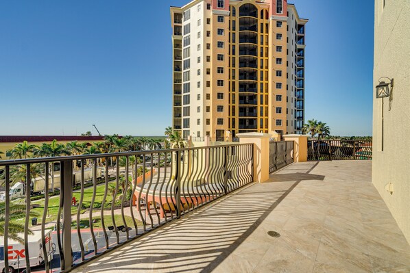 A high-rise building with a modern design, featuring balconies with metal railings. - Walk to Marina + Restaurants: Cape Coral Escape! (Cape Coral)