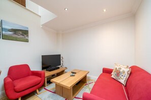 Deluxe Apartment, City View | Living area | LED TV