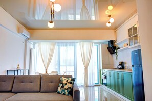 Appartement Exclusif | Coin séjour | Télévision à écran plat